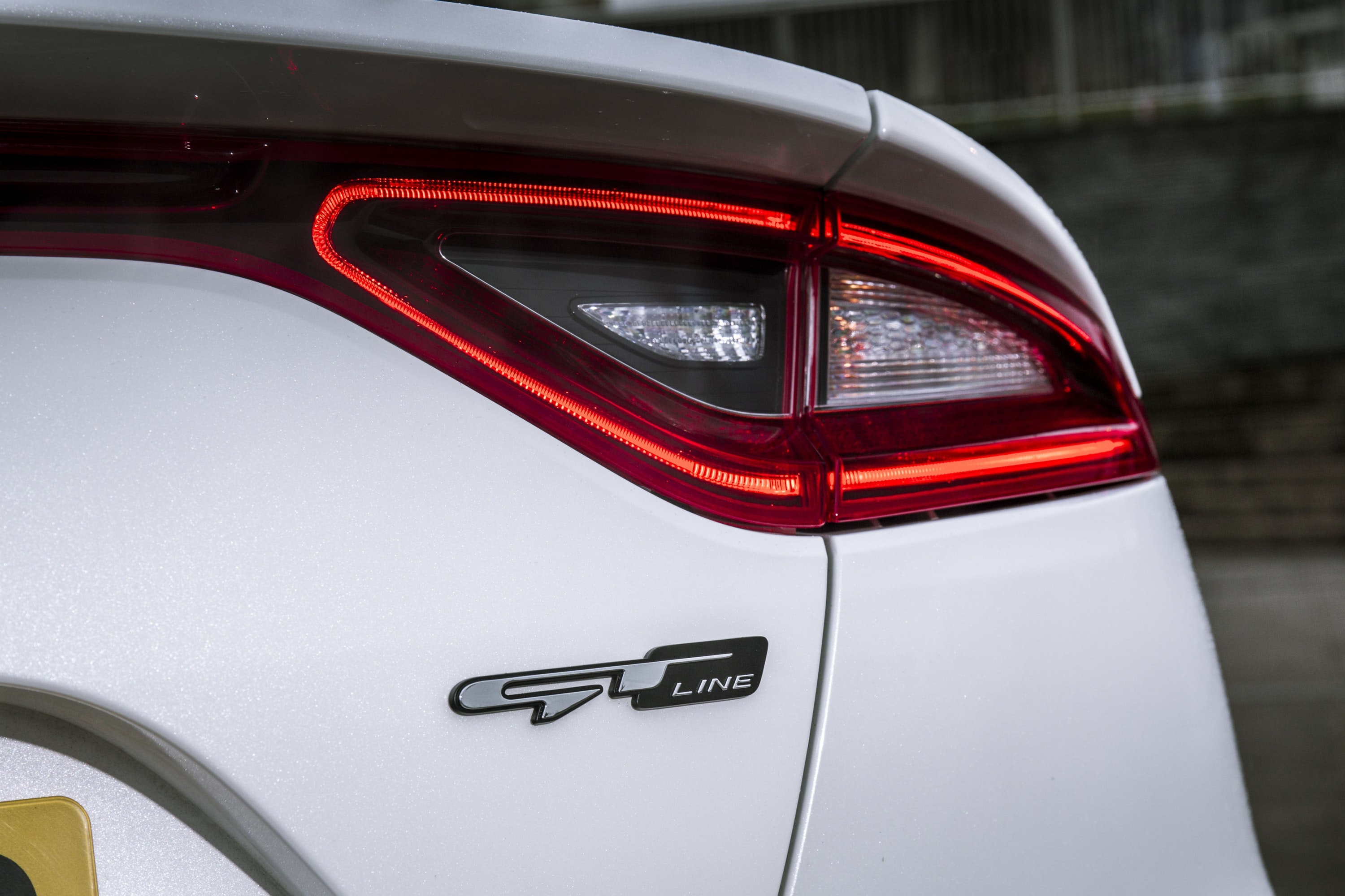 Close up of GT line badge and rear lights on Stinger